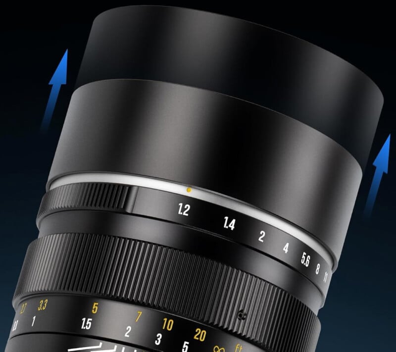 A close-up of a camera lens with a zoomed focus on the adjustment rings and numbers, featuring blue arrows indicating the extension or movement of the lens hood.