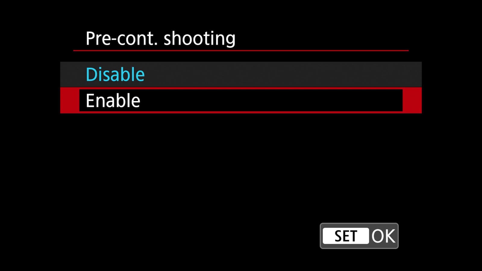 Camera menu screen displaying the "Pre-cont. shooting" setting with options "Disable" (highlighted) and "Enable." "SET" and "OK" buttons appear at the bottom right.