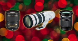 Three camera lenses are displayed against a background of red and green bokeh lights. The lenses are of different sizes and brands, positioned side by side horizontally.