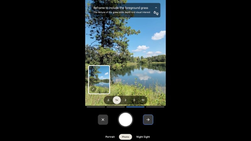 A smartphone camera app displays a preview of a lake scene with trees, grass, and blue sky. An on-screen tip suggests reframing to include the foreground grass. Camera controls appear at the bottom.