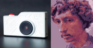 A small white toy camera with a red button sits on a black surface; next to it is a pixelated digital portrait of a person with curly hair, shown in purple and pink tones.