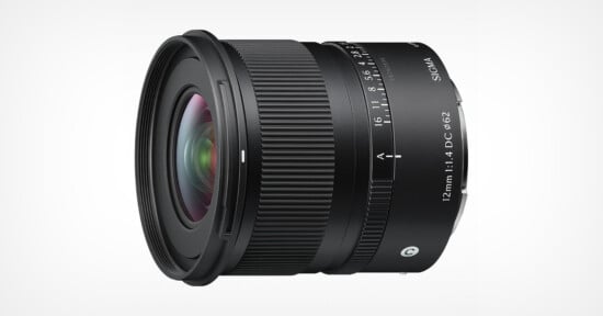 A black Sigma camera lens with "12mm 1:1.4 DC DN ø62" marked on the side, featuring a textured focus ring and aperture markings, shown against a plain white background.
